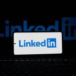 linkedin logo displayed on smartphone and laptop